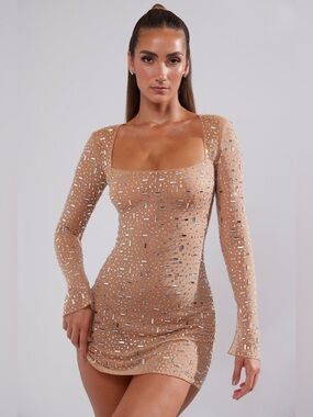 oh polly embellished mini dress in gold A dress we can see everyone loving this festive season Crafted from premium sequin-embellished fabric with a foil overlay, designed to catch the spotlight. , CELESTINA mini dress. Model wears UK